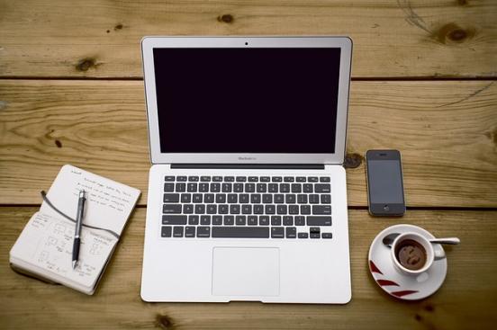 laptop and coffee on desk