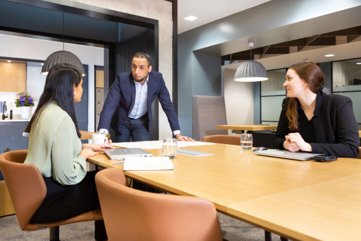 a meeting taking place in a landmark space office