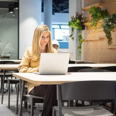 landmark office space in kings cross - a woman on her laptop