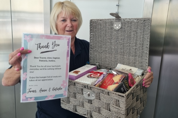 Landmark cleaner Tracy receiving a thank you gift in Landmark Reading Green Park